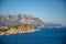 Aerial view of Sveti Nikola or St. Nicolas island is in Budva riviera on mountain background, Montenegro