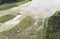 Aerial view of swamp and field with flood water