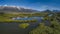 Aerial view on a swamp with mountains covered by ice