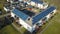 Aerial view of swedish apartment building covered with solar photovoltaic panels in Linkoping residential area