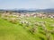 Aerial view of the Swiss village Nuglar with blooming orchard