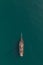 Aerial view of a tall mast sailing ship on a calm turquoise ocean