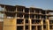 Aerial view of tall residential apartment buildings under construction.