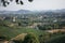 Aerial view of tea fields in Hangzhou on the mountain slopes, with the city in the background, China