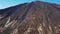 Aerial view of the Teide volcano in Teide National Park, flight over the mountains and hardened lava. Tenerife, Canary