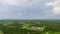 Aerial view of telecommunications cell phone tower with wireless communication 5g antennas for network signal