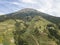 Aerial view of terraced vegetable gardens on the slopes of Mount Sumbing