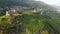 Aerial View - Terraced vineyards in the hills of Valtellina planted near monuments and old medieval ruins - Sondrio,