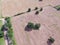 Aerial view Texas farmland prairie field bale hay on sunny day