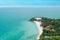 Aerial view from Thailand Koh Larn overlooking the community and the beaches with the sea during the day time amide the blue sk
