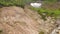 Aerial View. Thermal spring gushes out of the ground. Hot spring water in the mountains