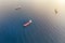 Aerial view of three container ships at sea engaged in transportation of cargo by water. Shipping cargo to harbor. Water transport