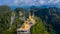 Aerial view Tiger Cave Temple, Buddha on the top Mountain with blue sky of Wat Tham Seua, Krabi,Thailand