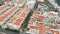 Aerial view. Tiled roofs of white resort houses off the coast of the Atlantic. The coastal city of Agaete, Gran Canaria.