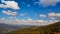 Aerial view time lapse of mountain clouds