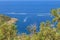 Aerial view of Tirrenic sea with boats, rocks, and vegetation of foreground. Copy space. Monte Argentario, Tuscany, Italy