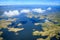 Aerial view to archipelago under few fluffy clouds