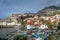 Aerial view to Camara de Lobos town and fishing boats harbor