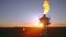 Aerial view to gas flare stack of petroleum refineries sunset background, flare pit tower