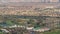 Aerial view to Golf course with green lawn and lakes, villa houses behind it timelapse.