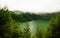 Aerial view to Lagoa de Santiago at fog, Sao Muel, Azores, Portugal