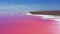 Aerial view to pink lake with salt shore with little islands with copy space in Ukraine
