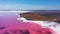 aerial view to pink lake with salt shore with little islands with copy space in Ukraine