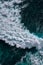 Aerial view to seething waves with foam. Waves of the sea meet each other