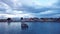 Aerial View to the Sitting Birds on the Old Wooden Pier under the Blue Sunset Sky in Puerto Natales,