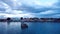 Aerial View to the Sitting Birds on the Old Wooden Pier under the Blue Sunset Sky in Puerto Natales,