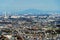 Aerial view of Tokyo apartments in cityscape background. Residential district in smart city in Asia. Buildings at noon. Japan