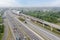 Aerial view of tollway with LRT train under blue sky