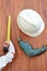 Aerial view of tools of wood working on wooden background. Measuring tape , safety helmet , electric drill