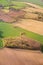 Aerial view from top on green irregular fields on south part of