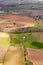 Aerial view from top on green irregular fields on south part of