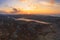 Aerial view from the top of a rocky mountain over Lapland landscape, lake and Barents Sea. Autumn sunset arctic panoramic