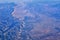 Aerial view of topographical Rocky Mountain landscapes on flight over Colorado and Utah during autumn. Grand sweeping views of riv