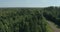Aerial view - tops of forest trees and a railway