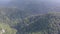 Aerial view of the tops of wooded mountains in the haze