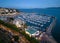 Aerial view of the Torquay Marina with moored boats and yachts in the evening