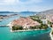 Aerial view of touristic old Trogir, historic town on a small island and harbour on the Adriatic coast in Split-Dalmatia, Croatia.