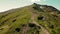 Aerial view tourists climbing to the top of the mountain on which the observatory and observation point are located