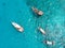 Aerial view of Tourists Snorkeling Around a boats on a Boat Tour at Zanzibar