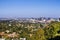 Aerial view towards the skyline of Century City commercial district; the downtown area skyscrapers visible in the background;