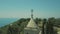 Aerial view. Tower of Catholic Cathedral is made of white stone on seashore.