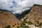 Aerial view of towering, cloud covered mountains at the exit of the Samaria Gorge Agia Roumeli, Crete