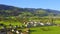 Aerial view of town and field at the foot of the mountain