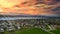 Aerial view of the town of Murten in Swizterland during a vibrant sunset in the sky