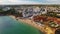 Aerial. View of town Olhos de Agua and a fishing beach from sky.