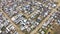 Aerial view, township and shack buildings in South Africa, Gugulethu or neighborhood outdoor. Drone, slums and area